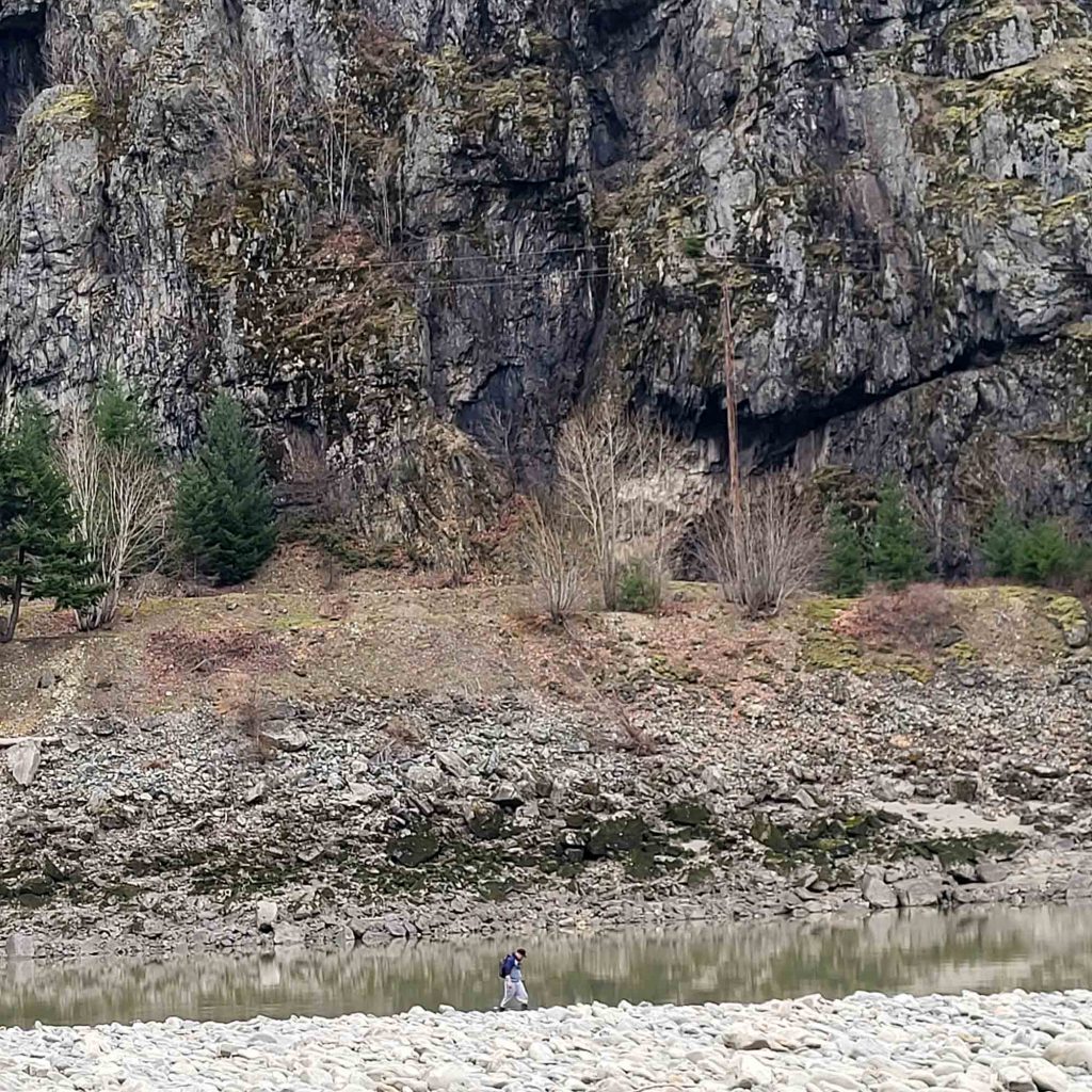 Rylan is walking along the endless rocks.